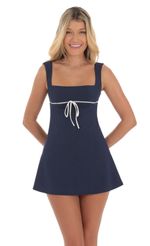 Picture Wide Strap Front Tie Dress in Navy. Source: https://media-img.lucyinthesky.com/data/Aug24/150xAUTO/35ff81e3-0ba8-4129-9f51-a44d8d4b64eb.jpg