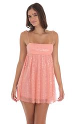 Picture Sequin Mesh Babydoll Dress in Coral. Source: https://media-img.lucyinthesky.com/data/Aug24/150xAUTO/76337568-196f-4cbf-98a3-2244bb7793f1.jpg