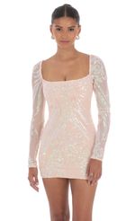 Picture Iridescent Sequin Long Sleeve Dress in Peach. Source: https://media-img.lucyinthesky.com/data/Aug24/150xAUTO/8a5c597c-51b5-4086-8210-c52f1bf3509f.jpg