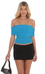 Picture Off Shoulder Ruched Top in Blue. Source: https://media-img.lucyinthesky.com/data/Aug24/150xAUTO/9714b004-2bed-4625-a610-7373474b4ffc.jpg