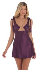 Picture Pearl Cutout Satin Dress in Purple. Source: https://media-img.lucyinthesky.com/data/Aug24/150xAUTO/b17c7dfe-e7f3-447d-9e0c-2201dd80f25d.jpg