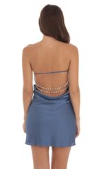 Picture Satin Pearl Open Back Dress in Slate Blue. Source: https://media-img.lucyinthesky.com/data/Aug24/150xAUTO/b7d77bf4-a0b3-49e7-9174-87319c1975f8.jpg