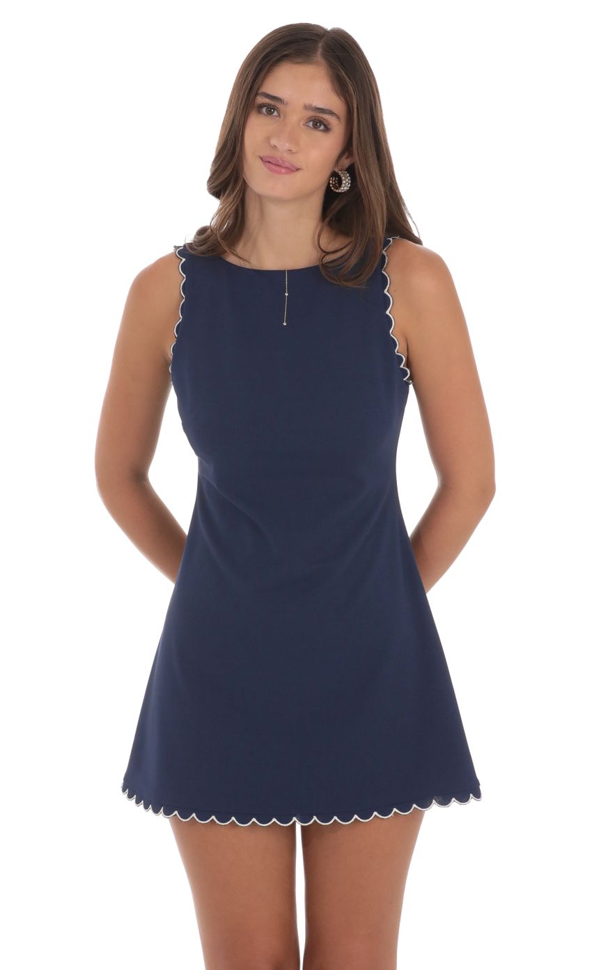 Picture Scallop Sleeve Dress in Navy. Source: https://media-img.lucyinthesky.com/data/Aug24/850xAUTO/35273b0f-db97-402f-a1ae-dd8a6c54b0cc.jpg