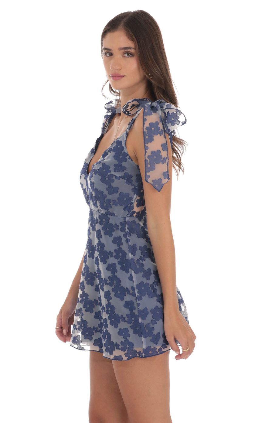 Picture Floral A-line Dress in Navy. Source: https://media-img.lucyinthesky.com/data/Aug24/850xAUTO/431c4158-fdc1-4d19-9e0d-a017e251f792.jpg