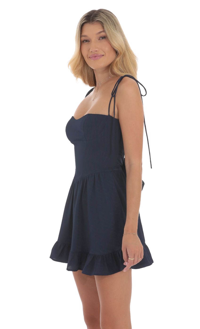 Picture Open Back Ruffle Dress in Navy. Source: https://media-img.lucyinthesky.com/data/Aug24/850xAUTO/4fbb0efa-39ad-4124-a1f7-e29790200f6e.jpg