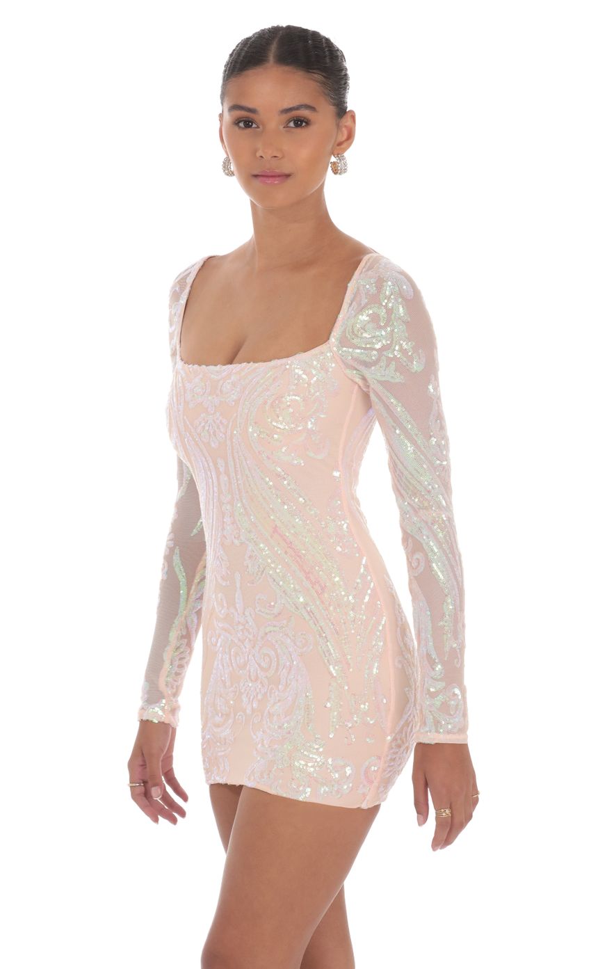 Picture Iridescent Sequin Long Sleeve Dress in Peach. Source: https://media-img.lucyinthesky.com/data/Aug24/850xAUTO/5fe4a7c9-afb6-487e-a225-91ed372eda38.jpg