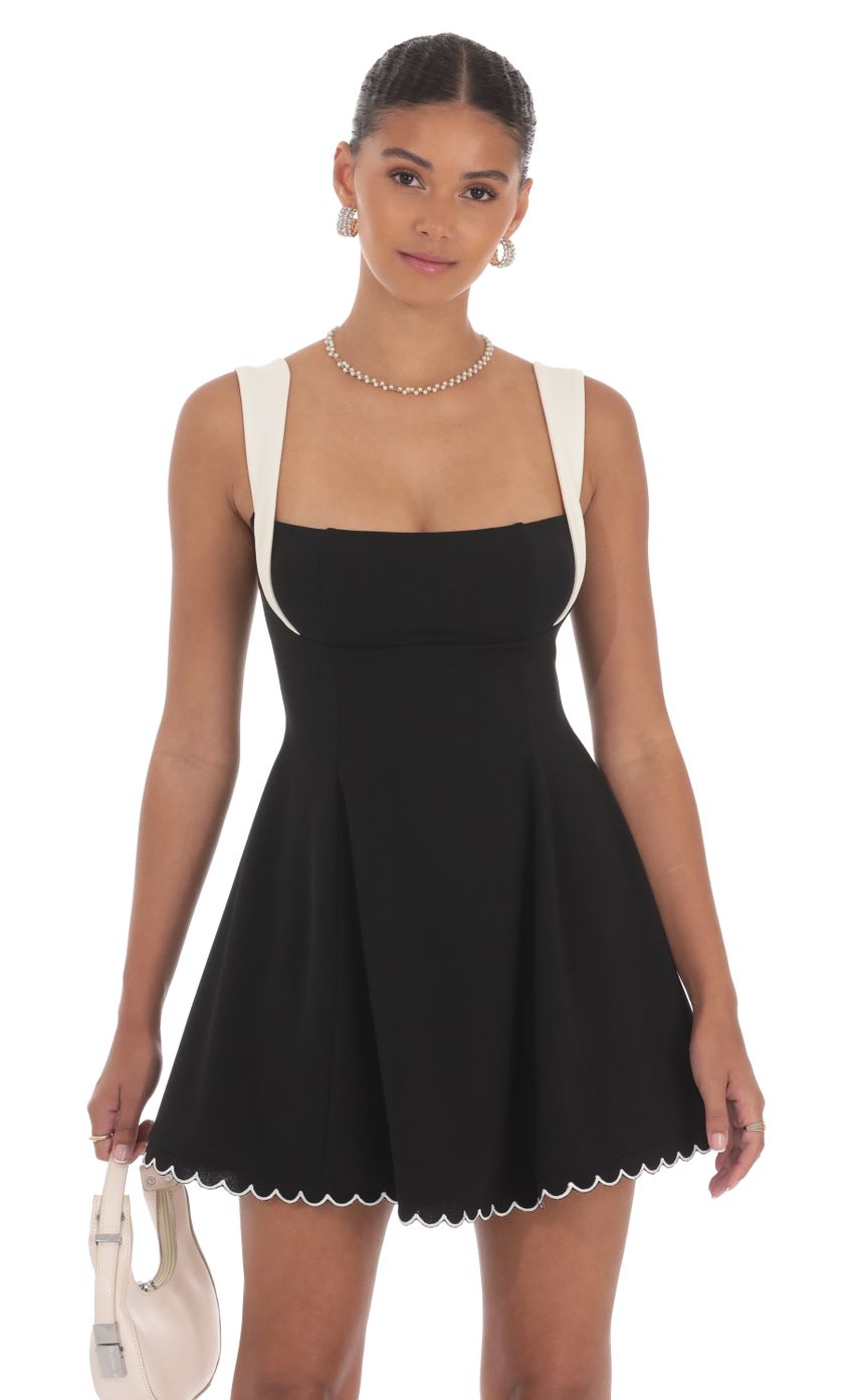 Picture Scallop Hem Fit and Flare Dress in Black. Source: https://media-img.lucyinthesky.com/data/Aug24/850xAUTO/6e0a496c-af4a-4a50-9577-98ea2d66c70f.jpg