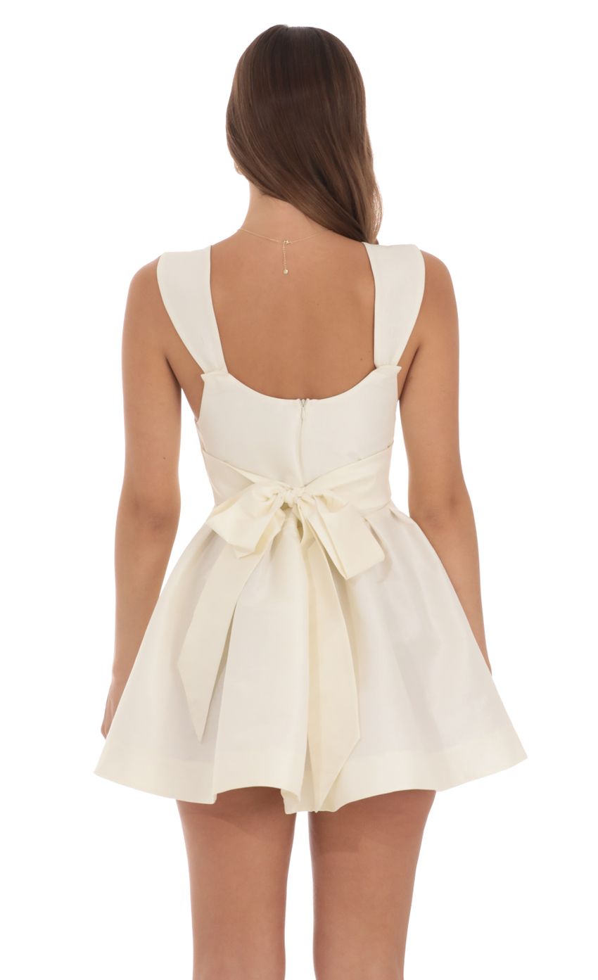 Picture Double Bow A-Line Dress in Off White. Source: https://media-img.lucyinthesky.com/data/Aug24/850xAUTO/9e58f42b-884c-4570-9f50-50485d1bcd85.jpg