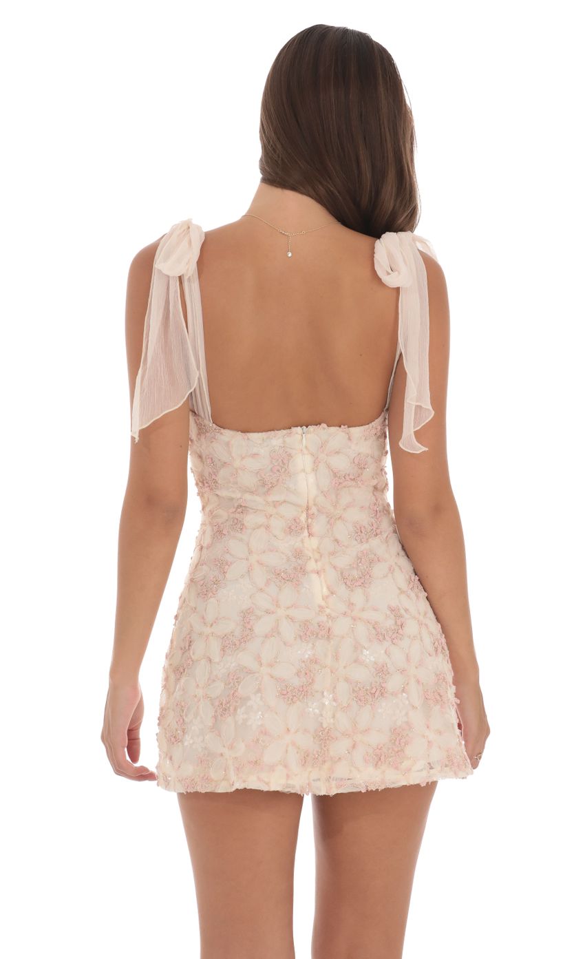 Picture Textured Shimmer Floral Dress in Cream. Source: https://media-img.lucyinthesky.com/data/Aug24/850xAUTO/a36b1733-a057-4cfe-b73f-9987cb2afd01.jpg