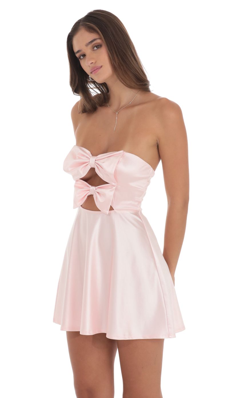 Picture Satin Double Bow Cutout Dress in Pink. Source: https://media-img.lucyinthesky.com/data/Aug24/850xAUTO/b5b9b2a0-2f1e-49c1-8c6f-41254b3cb4cb.jpg