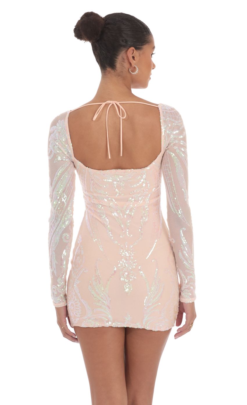 Picture Iridescent Sequin Long Sleeve Dress in Peach. Source: https://media-img.lucyinthesky.com/data/Aug24/850xAUTO/b5cd53dc-67f1-4f53-bb6f-ad494db04284.jpg