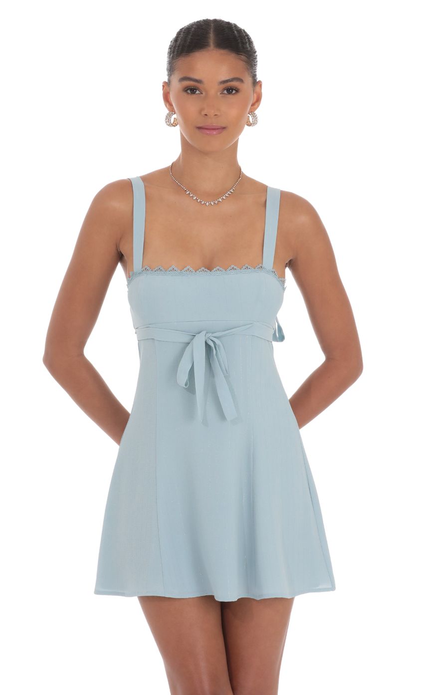 Picture Shimmer Ribbon Embroidered Trim Dress in Blue. Source: https://media-img.lucyinthesky.com/data/Aug24/850xAUTO/eca810dc-4f83-49b0-8a8b-a34a461c79ab.jpg