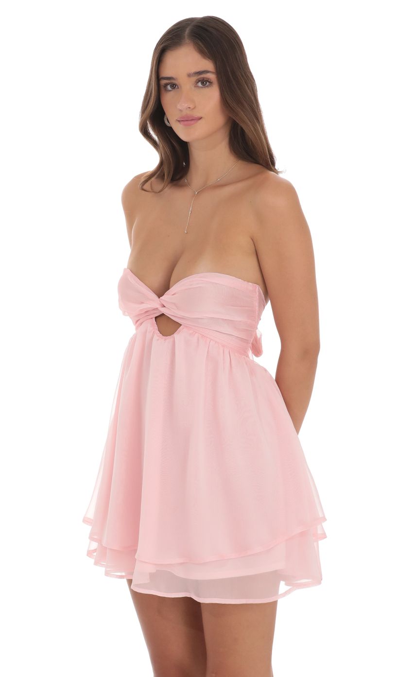 Picture Two-Toned Chiffon Cutout Babydoll Dress in Pink. Source: https://media-img.lucyinthesky.com/data/Aug24/850xAUTO/f821f738-f931-4b98-a25a-438d396f8202.jpg