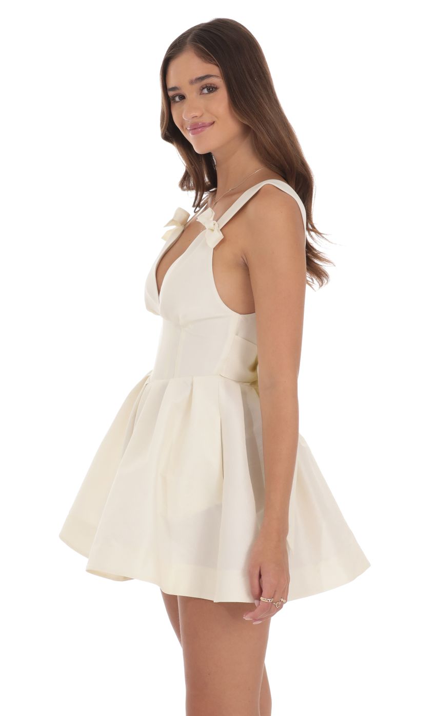 Picture Double Bow A-Line Dress in Off White. Source: https://media-img.lucyinthesky.com/data/Aug24/850xAUTO/faf66469-4372-447c-b0a1-7f822f29d86d.jpg