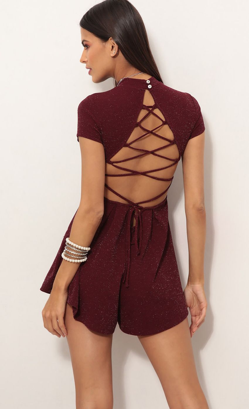 Picture Gaia High Neck Shimmer Romper In Wine. Source: https://media-img.lucyinthesky.com/data/Dec18_2/850xAUTO/0Y5A0733.JPG