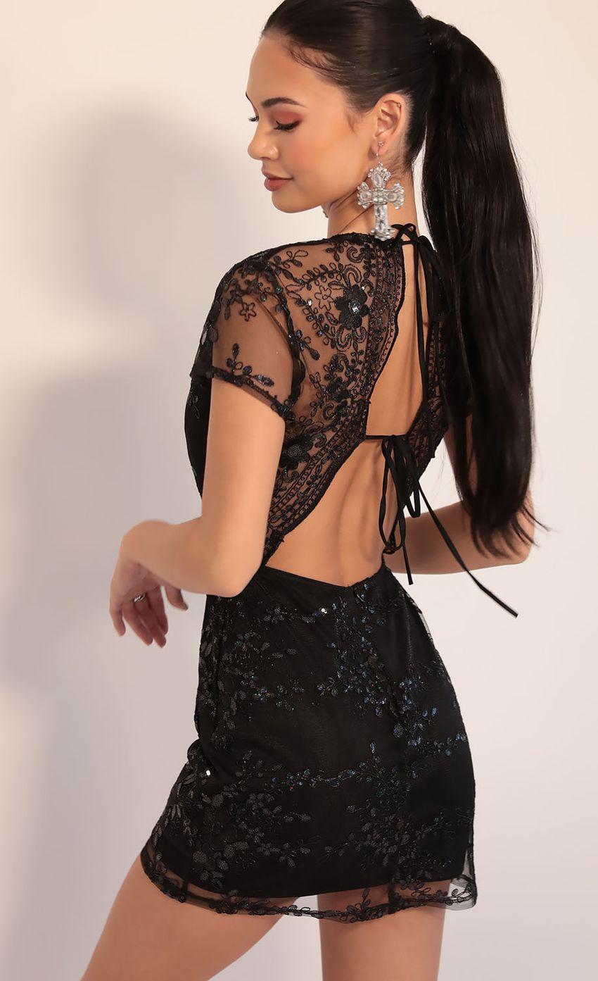 Picture Lani Sequin Plunge Lace Dress in Black Iridescence. Source: https://media-img.lucyinthesky.com/data/Dec19_2/850xAUTO/781A1324.JPG
