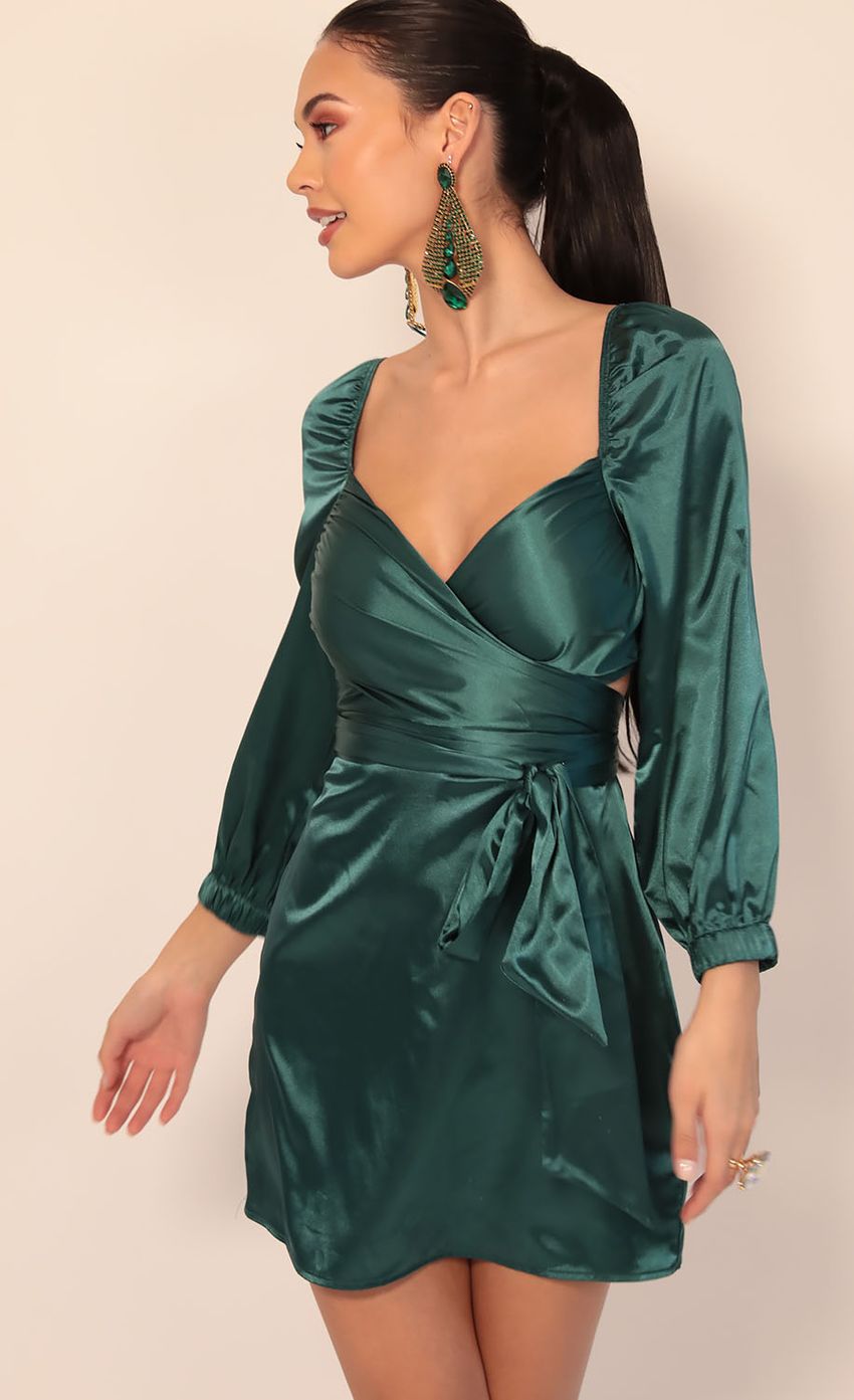 Picture Miley Puff Sleeve Wrap Dress in Hunter Green. Source: https://media-img.lucyinthesky.com/data/Dec19_2/850xAUTO/781A4904.JPG