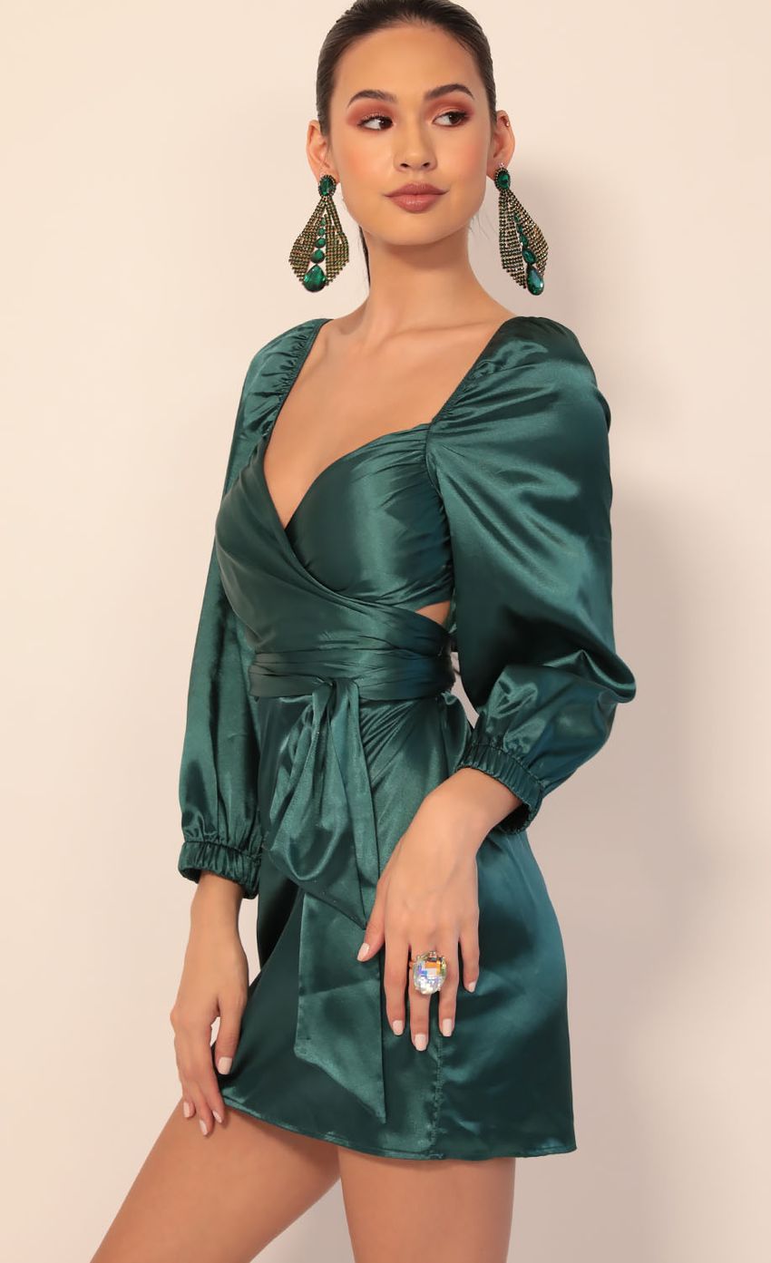 Picture Miley Puff Sleeve Wrap Dress in Hunter Green. Source: https://media-img.lucyinthesky.com/data/Dec19_2/850xAUTO/781A4925.JPG
