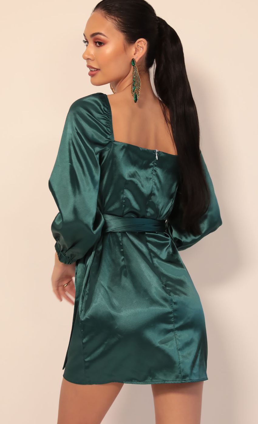 Picture Miley Puff Sleeve Wrap Dress in Hunter Green. Source: https://media-img.lucyinthesky.com/data/Dec19_2/850xAUTO/781A4960.JPG
