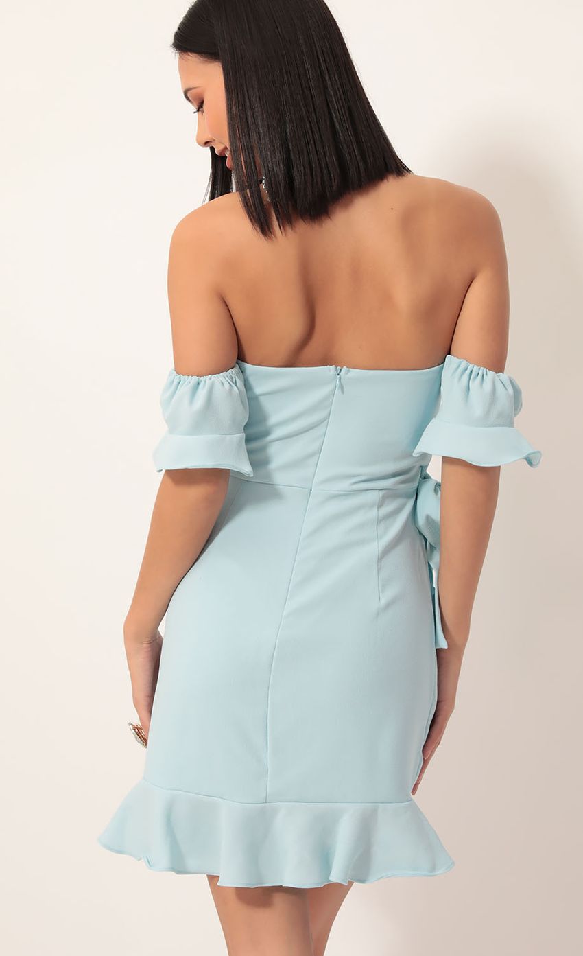 Picture Melrose Off Shoulder Wrap Dress in Light Blue. Source: https://media-img.lucyinthesky.com/data/Dec19_2/850xAUTO/781A8015.JPG