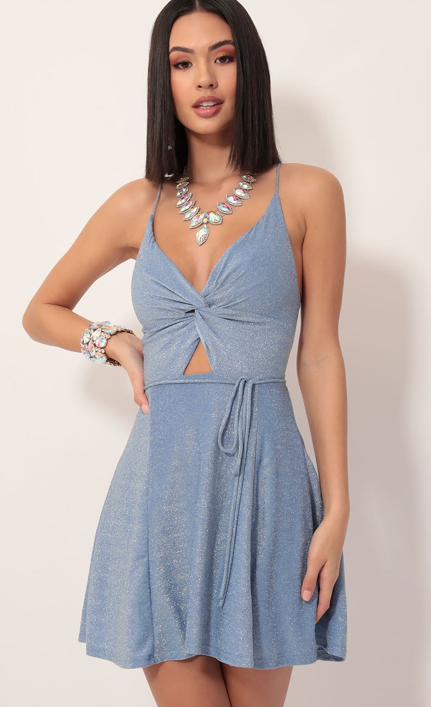 Picture Adalee Front Twist Dress in Blue Shimmer. Source: https://media-img.lucyinthesky.com/data/Dec19_2/850xAUTO/781A9860.JPG