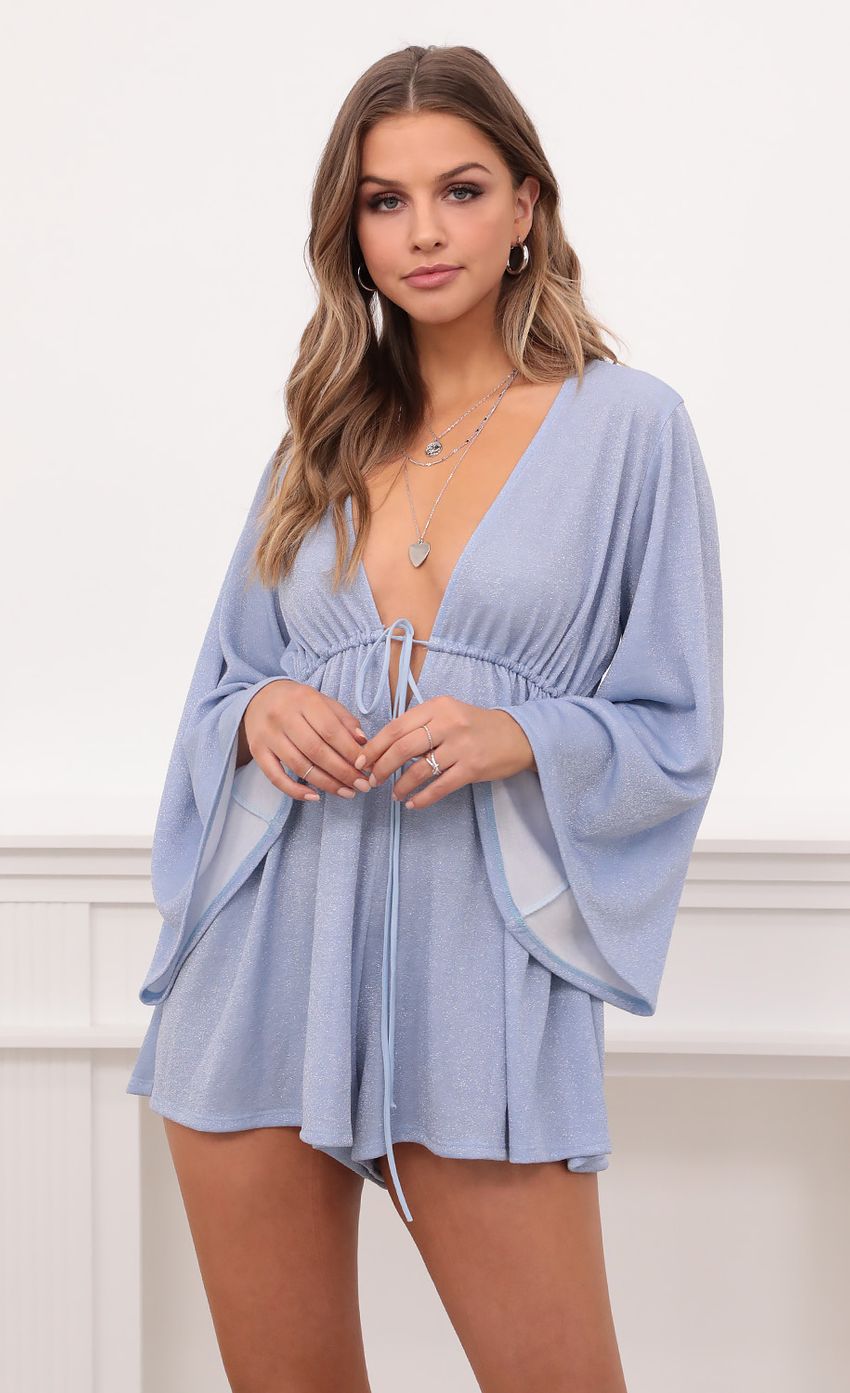 Picture Kadee Bell Sleeve Romper in Powder Blue Shimmer. Source: https://media-img.lucyinthesky.com/data/Dec20_2/850xAUTO/1V9A0033.JPG