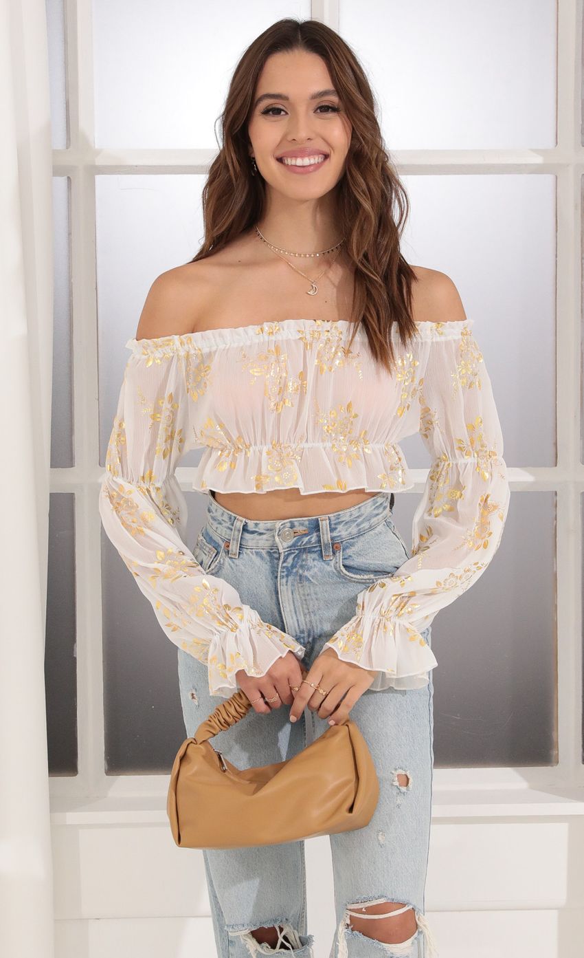 Picture Off Shoulder Top in White and Gold. Source: https://media-img.lucyinthesky.com/data/Dec21_1/850xAUTO/1V9A6641.JPG