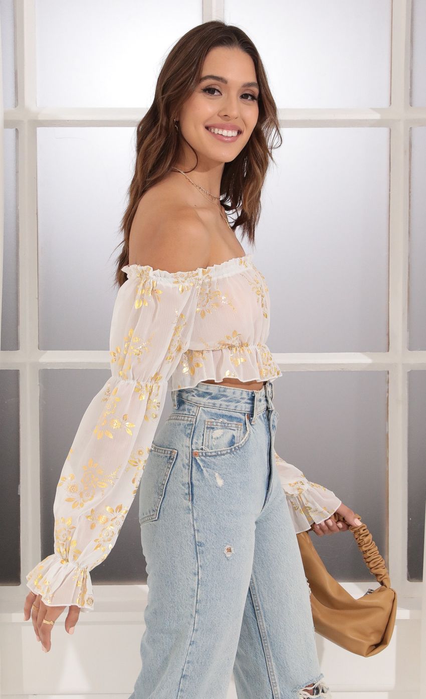 Picture Off Shoulder Top in White and Gold. Source: https://media-img.lucyinthesky.com/data/Dec21_1/850xAUTO/1V9A6688.JPG