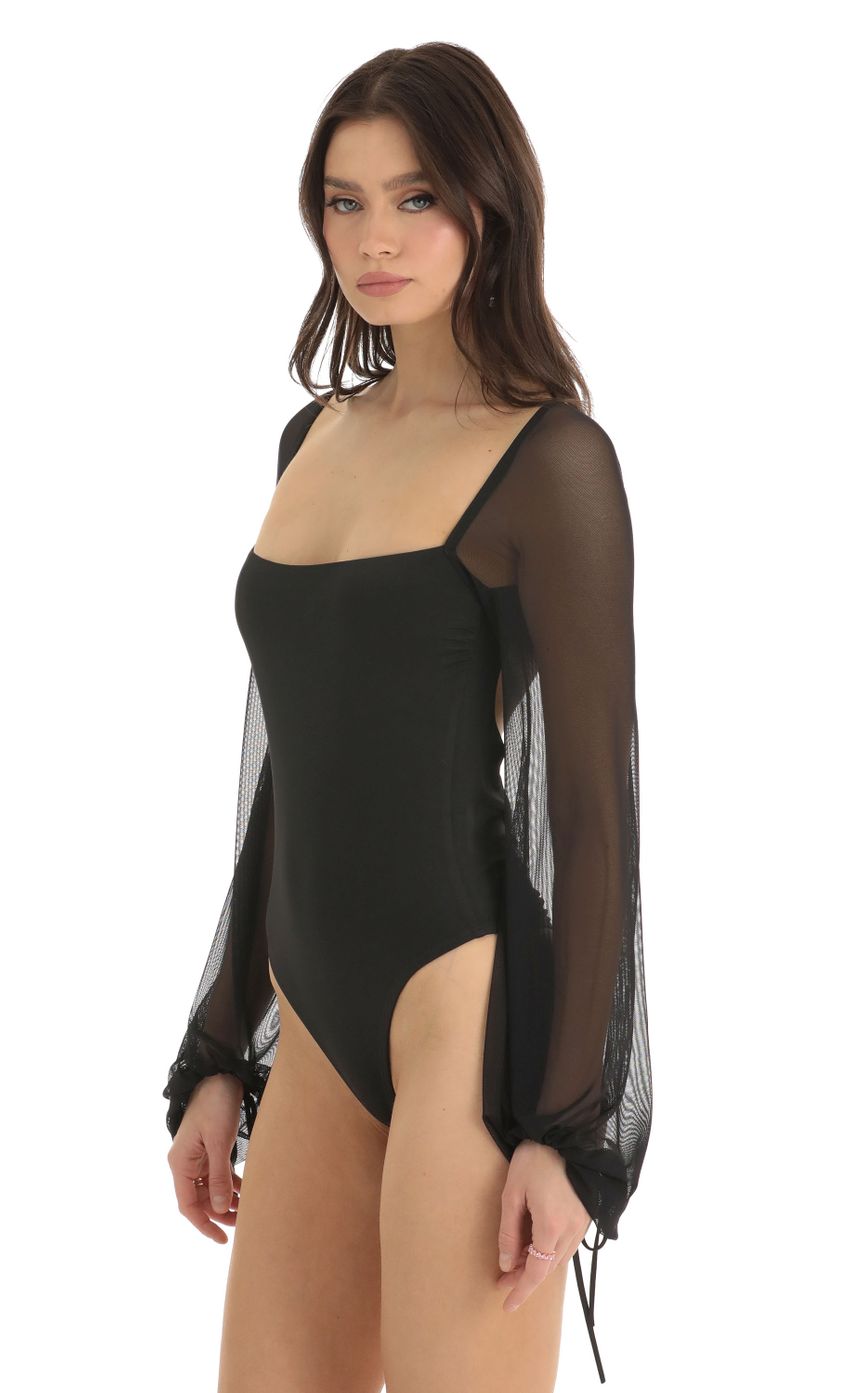 Picture Mesh Long Sleeve Bodysuit in Black. Source: https://media-img.lucyinthesky.com/data/Dec22/850xAUTO/01196464-ca9c-476e-b9d3-49ef6c5af431.jpg
