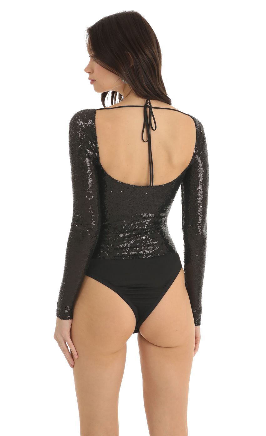 Picture Sequin Long Sleeve Bodysuit in Black. Source: https://media-img.lucyinthesky.com/data/Dec22/850xAUTO/0398b307-35f0-4d91-8283-58a254e48f79.jpg
