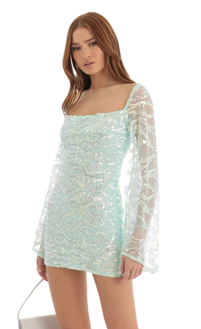 Picture Flare Sleeve Sequin Dress in Turquoise. Source: https://media-img.lucyinthesky.com/data/Dec22/850xAUTO/0b664867-489d-454f-bad3-28e6b2f72f3e.jpg