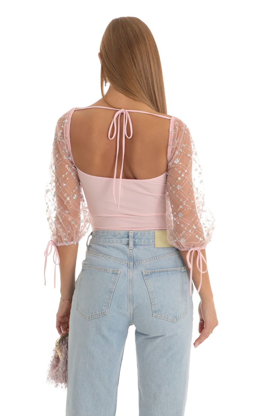 Picture Sequin Puff Sleeve Bodysuit in Pink. Source: https://media-img.lucyinthesky.com/data/Dec22/850xAUTO/1241a6fa-e71d-4e2d-842a-e615bb80e133.jpg