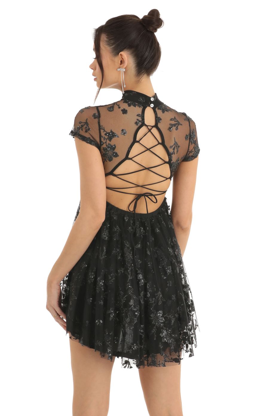Picture Floral Sequin Baby Doll Dress in Black. Source: https://media-img.lucyinthesky.com/data/Dec22/850xAUTO/19aa859e-b80e-4aa0-886b-4489c5abc8d8.jpg