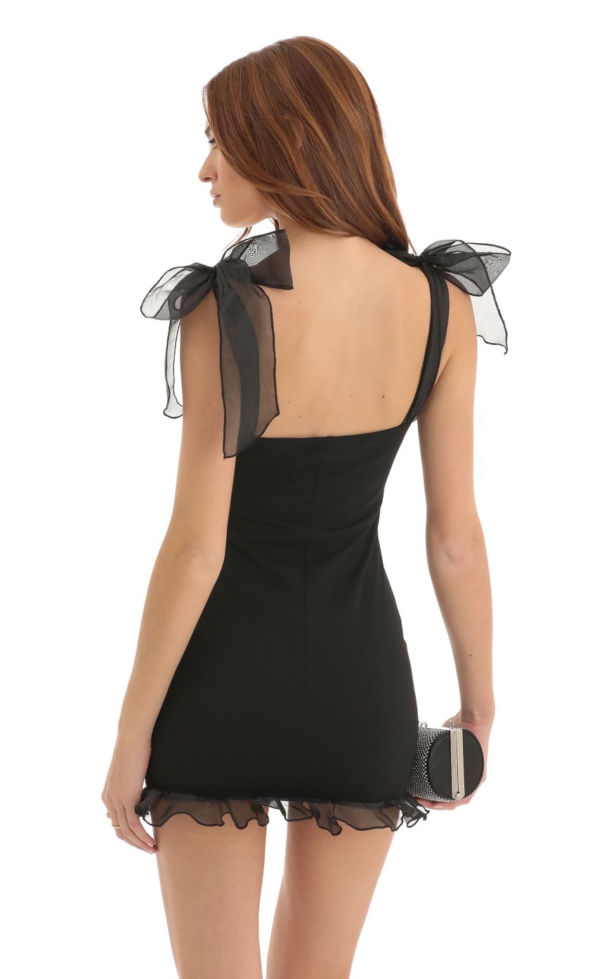 Picture Crepe Ruffle Dress in Black. Source: https://media-img.lucyinthesky.com/data/Dec22/850xAUTO/1ce93d29-0265-400d-8524-a965ed9de250.jpg