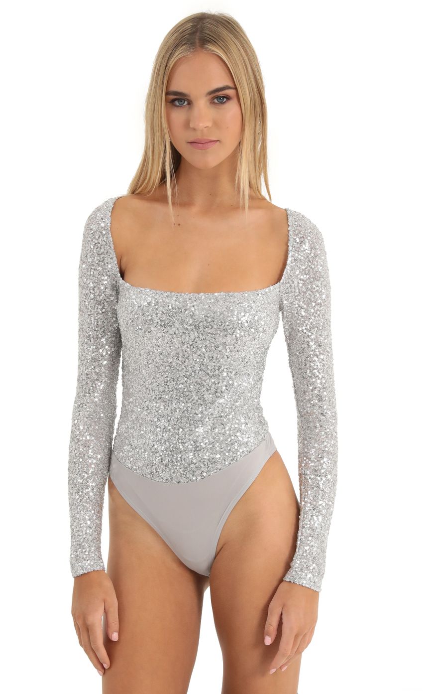 Picture Aislin Sequin Long Sleeve Bodysuit in Silver. Source: https://media-img.lucyinthesky.com/data/Dec22/850xAUTO/2235d5b6-b59a-4fa2-ab11-499b110f53f3.jpg