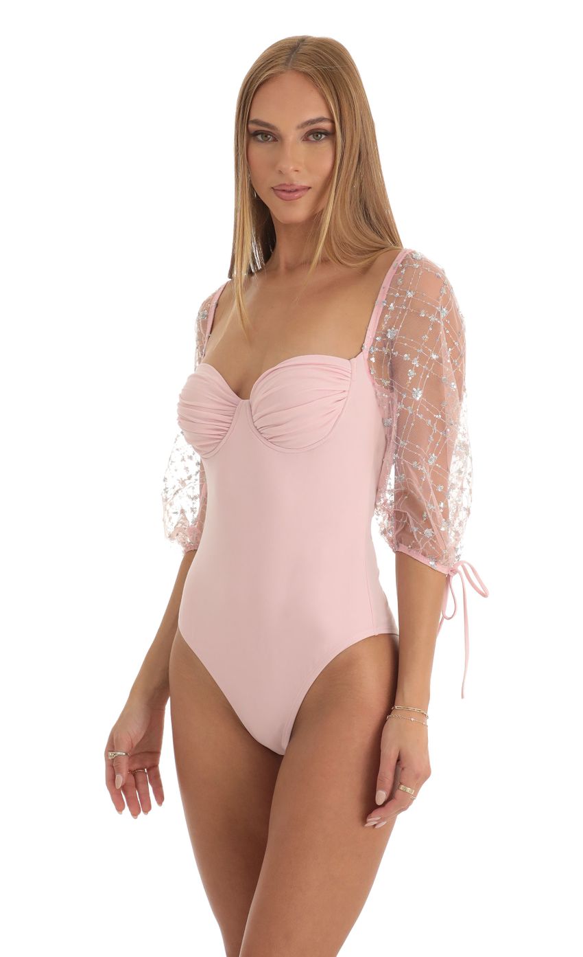 Picture Sequin Puff Sleeve Bodysuit in Pink. Source: https://media-img.lucyinthesky.com/data/Dec22/850xAUTO/2a0249c0-1170-4545-9b3b-03247884343d.jpg