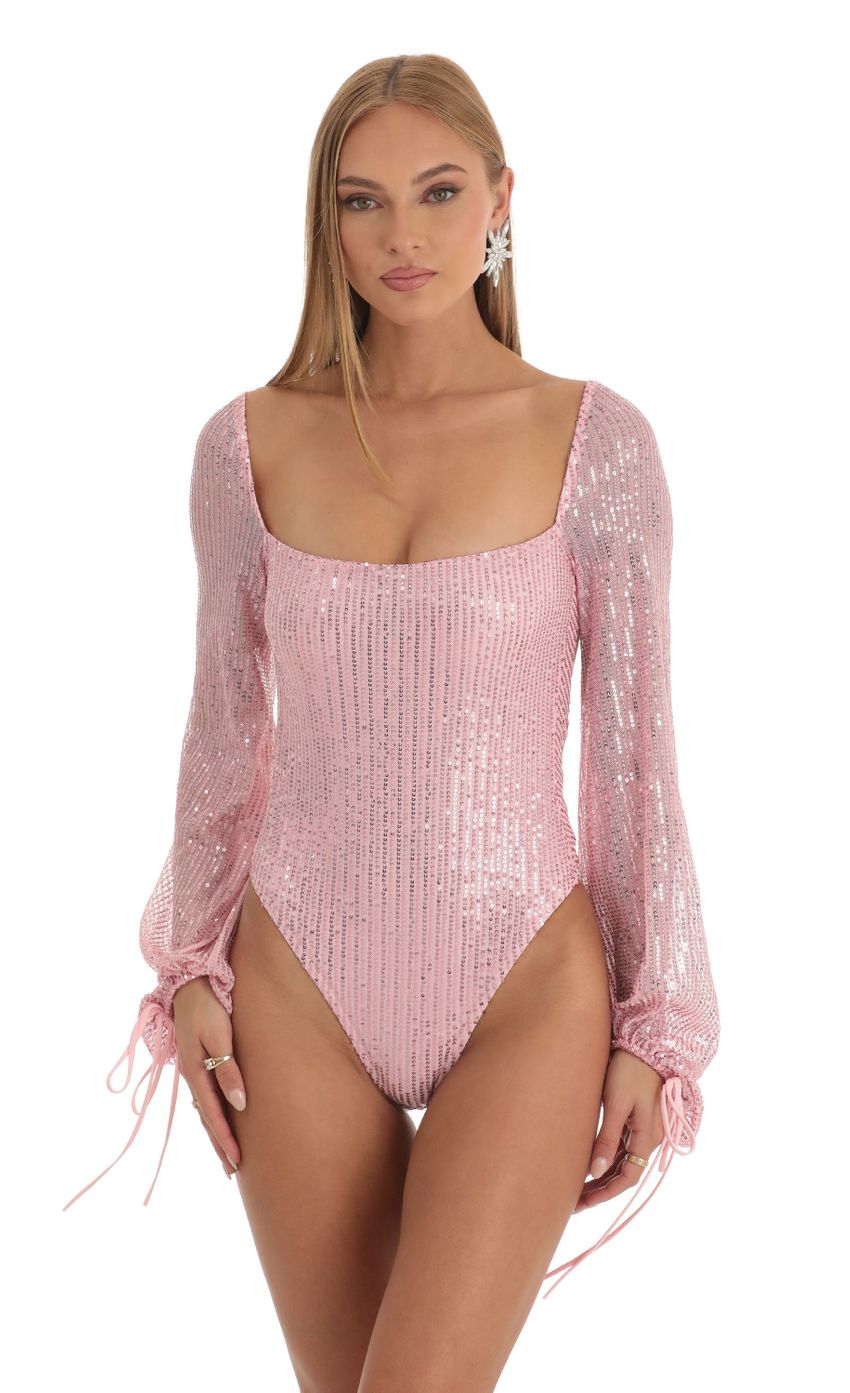 Picture Amory Sequin Long Sleeve Bodysuit in Pink. Source: https://media-img.lucyinthesky.com/data/Dec22/850xAUTO/34cfaf03-8a51-47cb-a3a1-b1438a12c949.jpg