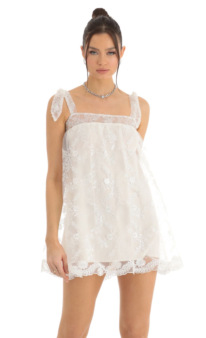 Picture Tulle Sequin Shift Dress in White. Source: https://media-img.lucyinthesky.com/data/Dec22/850xAUTO/4c7cecfc-87ee-480a-910b-cafc098e912b.jpg