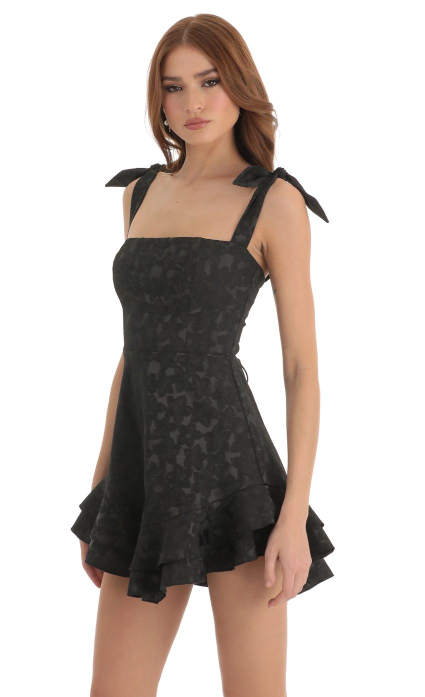 Picture Floral Jacquard Ruffle Dress in Black. Source: https://media-img.lucyinthesky.com/data/Dec22/850xAUTO/523952db-6cd7-4151-bbaa-dabccd1f00e2.jpg