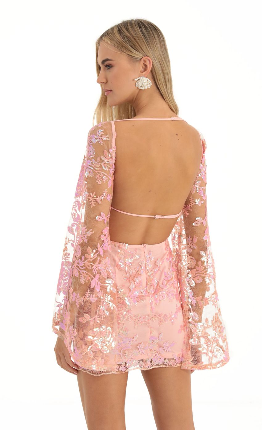 Picture Lace Sequin Flare Sleve Dress in Peach. Source: https://media-img.lucyinthesky.com/data/Dec22/850xAUTO/5dbe6baf-571c-4302-abaf-19b25cc69711.jpg
