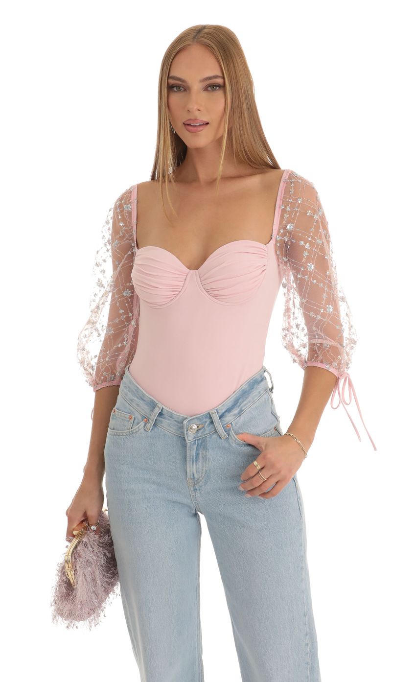 Picture Sequin Puff Sleeve Bodysuit in Pink. Source: https://media-img.lucyinthesky.com/data/Dec22/850xAUTO/5e83f807-bf57-4c7e-941e-239f7d0264fb.jpg
