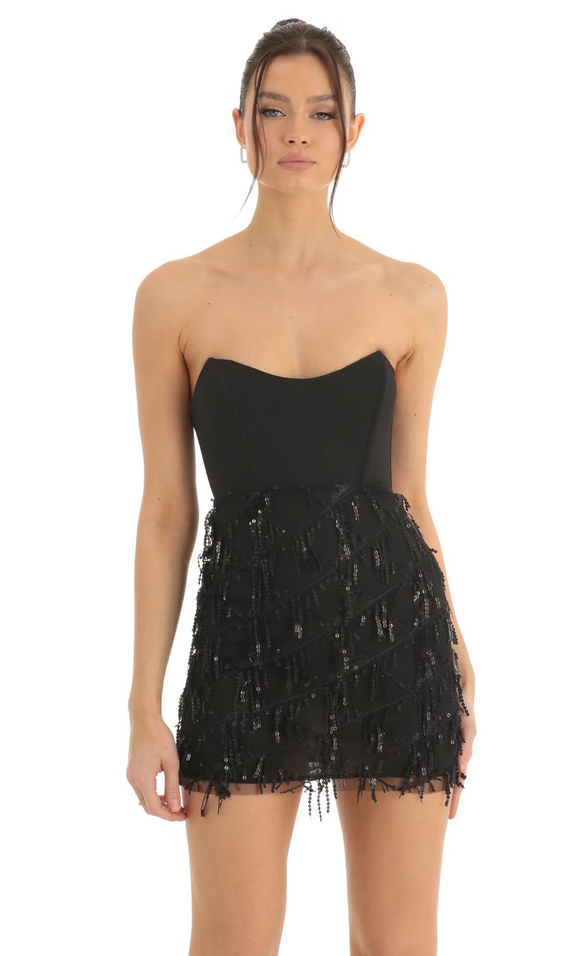 Picture Dangling Sequin Corset Dress in Black. Source: https://media-img.lucyinthesky.com/data/Dec22/850xAUTO/665db9d4-9e1c-4afb-80bf-43b7805be792.jpg