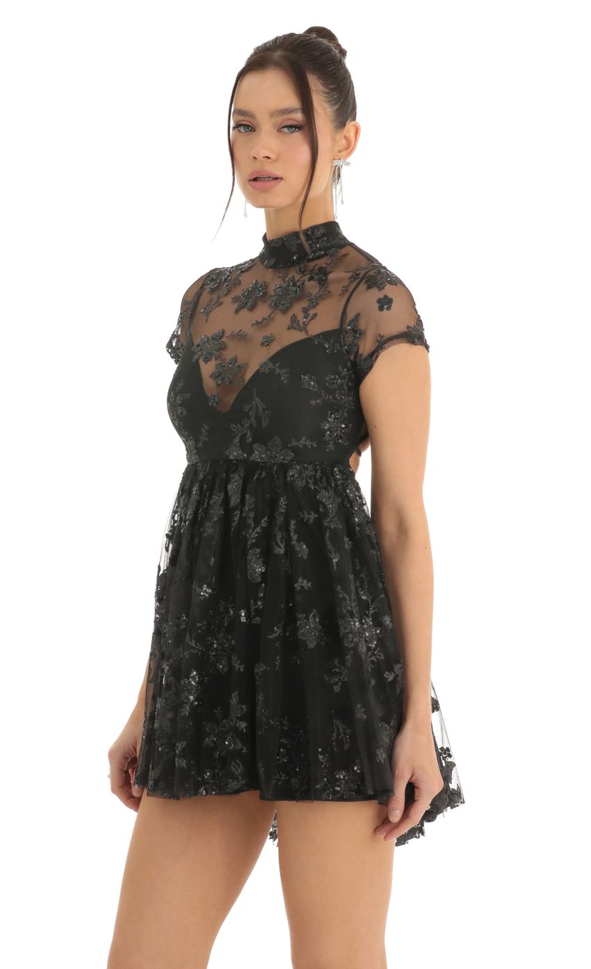 Picture Floral Sequin Baby Doll Dress in Black. Source: https://media-img.lucyinthesky.com/data/Dec22/850xAUTO/6f398c56-591b-4db0-988d-6ab4de0dd93d.jpg