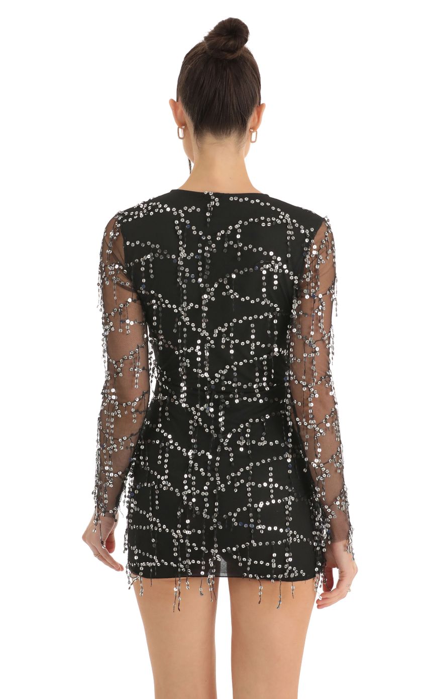 Picture Dangling Sequin Plunge Dress in Black. Source: https://media-img.lucyinthesky.com/data/Dec22/850xAUTO/7857e958-9af5-4bb8-8c30-1ba703aa0fbe.jpg
