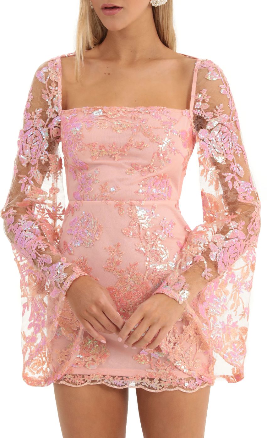 Picture Lace Sequin Flare Sleve Dress in Peach. Source: https://media-img.lucyinthesky.com/data/Dec22/850xAUTO/79a2388a-60fd-4838-ab0e-f0caccdc4c6f.jpg