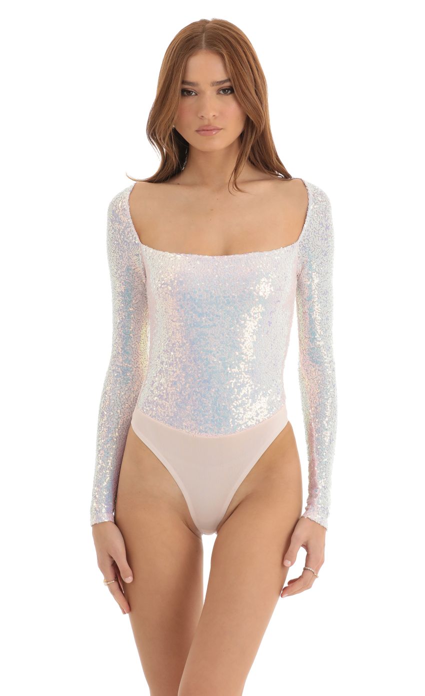 Picture Aislin Iridescent Sequin Long Sleeve Bodysuit in White. Source: https://media-img.lucyinthesky.com/data/Dec22/850xAUTO/8271ecf9-1845-4f96-b0ff-b43745eb1077.jpg