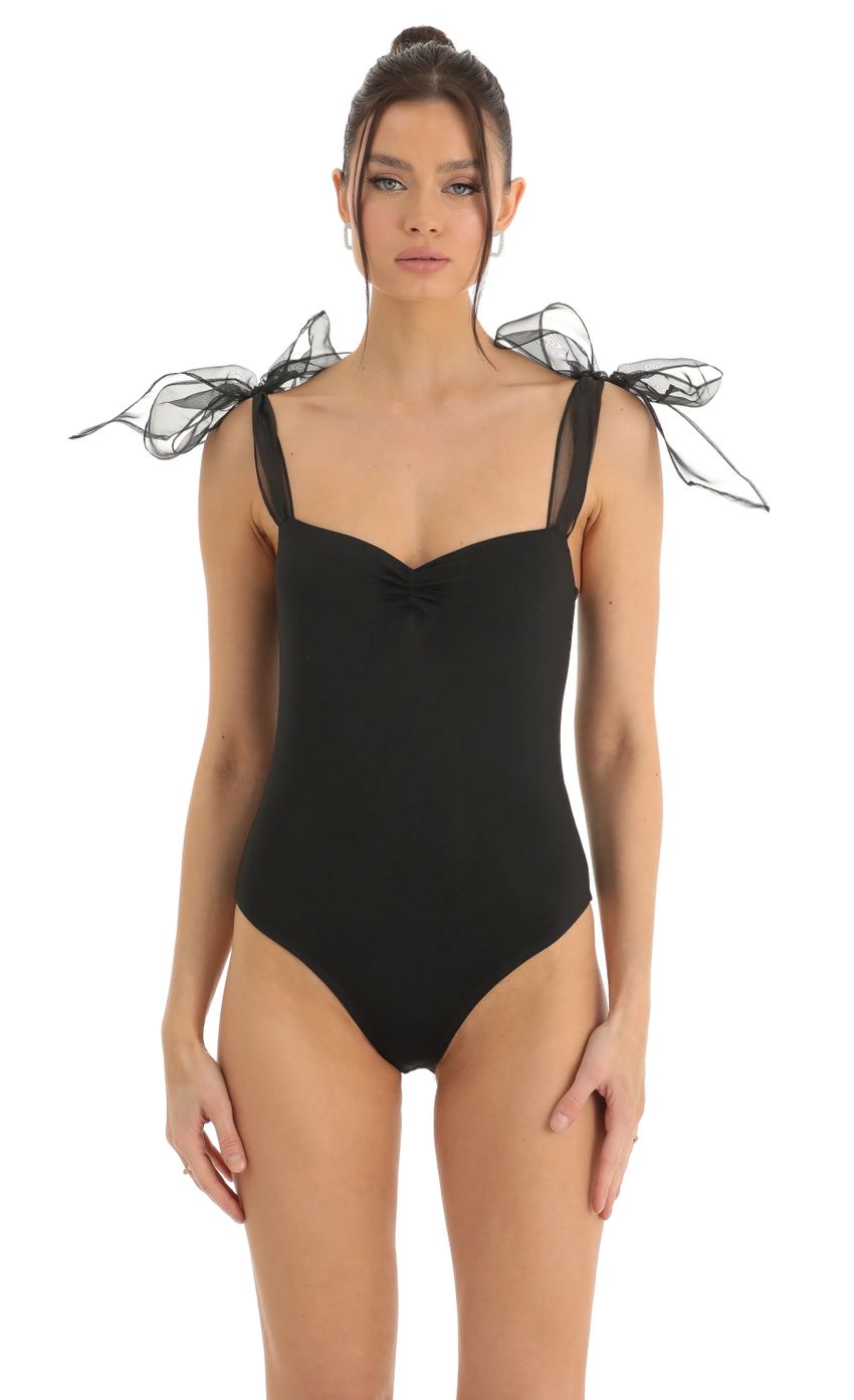 Picture Bow Bodysuit in Black. Source: https://media-img.lucyinthesky.com/data/Dec22/850xAUTO/9a188e3f-553b-45e9-a00c-a07f29d4d7af.jpg