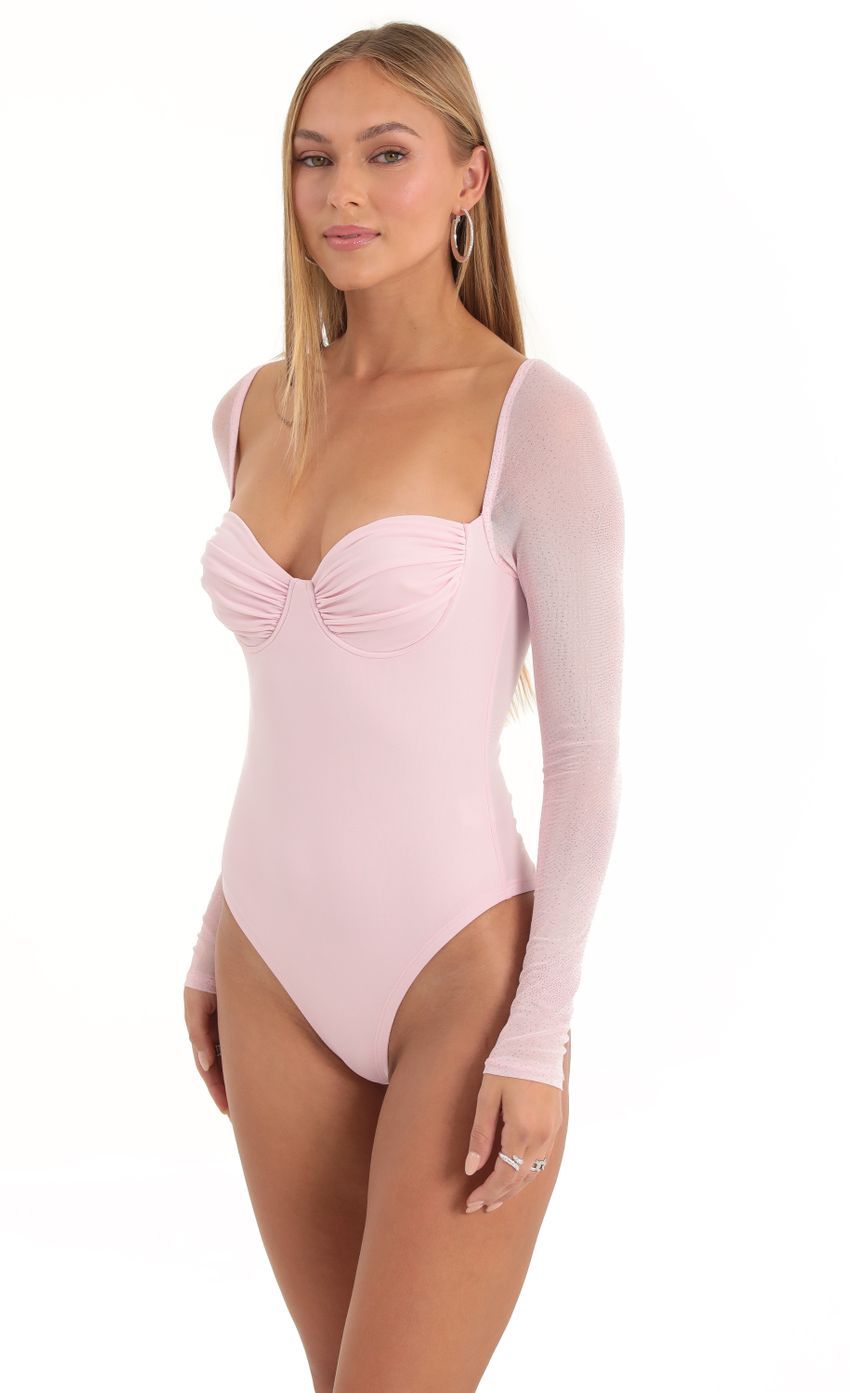 Picture Glitter Mesh Long Sleeve Bodysuit in Pink. Source: https://media-img.lucyinthesky.com/data/Dec22/850xAUTO/ae1e7969-3fbf-45d9-9336-33f59353891f.jpg