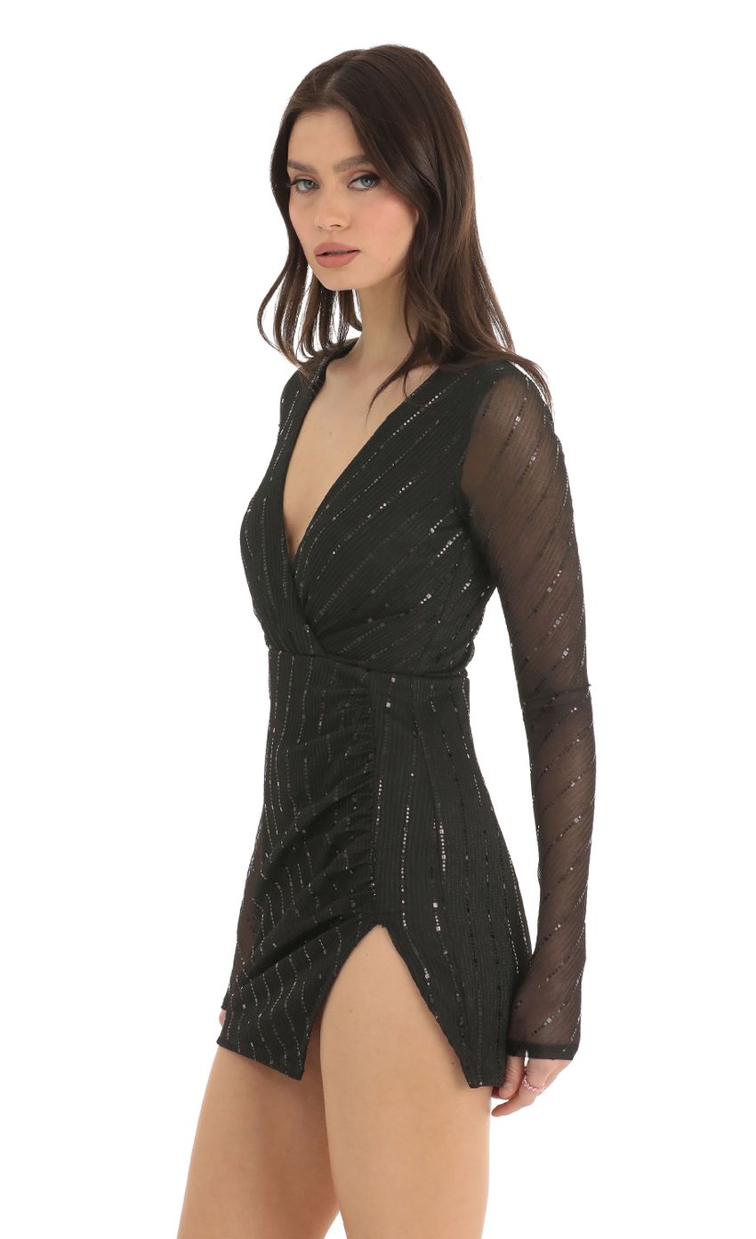 Picture Striped Sequin Long Sleeve Dress in Black. Source: https://media-img.lucyinthesky.com/data/Dec22/850xAUTO/c09e67e0-1d5e-4154-9301-596040256c83.jpg