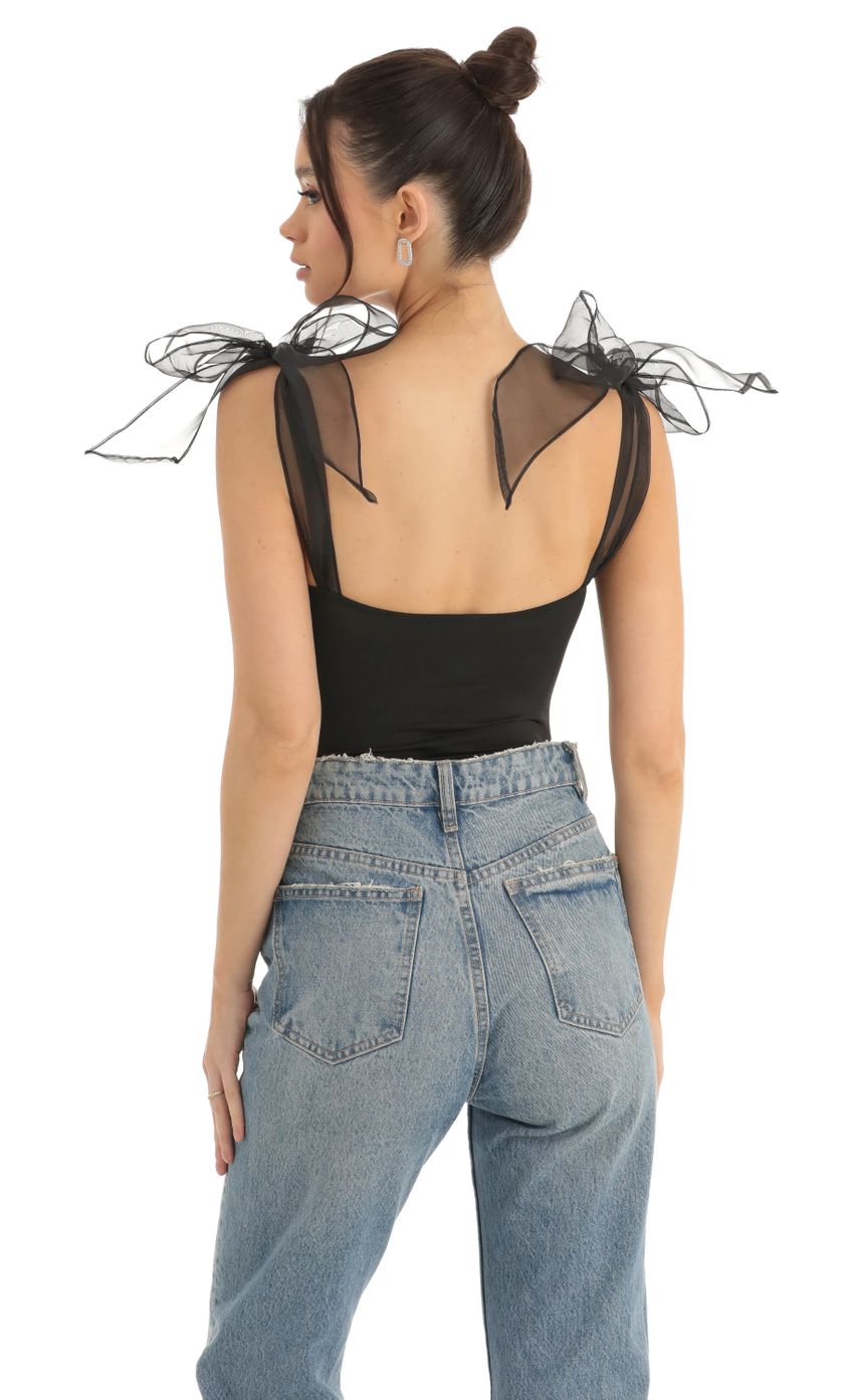 Picture Bow Bodysuit in Black. Source: https://media-img.lucyinthesky.com/data/Dec22/850xAUTO/c767b260-f1b7-4905-af46-49e3ee172109.jpg